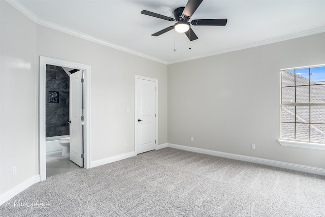 unfurnished bedroom with carpet floors, ornamental molding, and baseboards