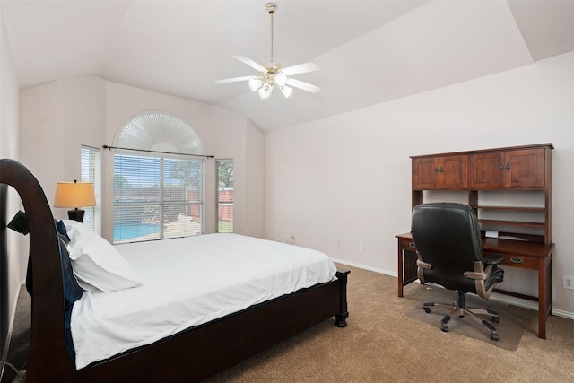 bedroom featuring baseboards, lofted ceiling, and light carpet