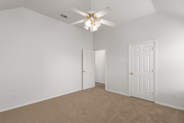 unfurnished bedroom featuring vaulted ceiling, ceiling fan, carpet, baseboards, and visible vents