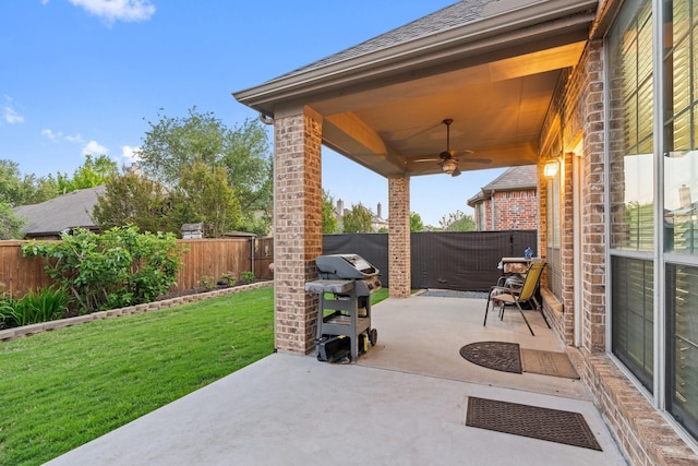 view of patio / terrace featuring grilling area, a fenced backyard, and ceiling fan