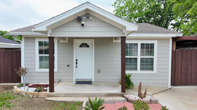 2904 Chestnut Ave, Fort Worth, TX 76106 - view of front of property featuring fence, a porch, and a shingled roof