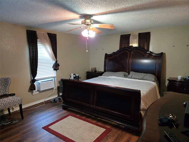 bedroom with a ceiling fan, a textured ceiling, cooling unit, dark wood finished floors, and baseboards