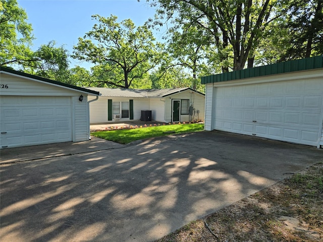 single story home featuring central AC unit