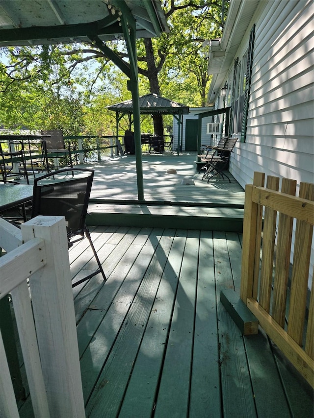 wooden deck featuring a gazebo