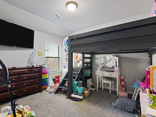 bedroom with vaulted ceiling, carpet flooring, and visible vents