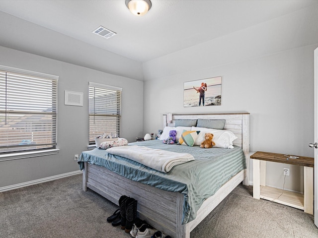 bedroom featuring baseboards, carpet flooring, and visible vents