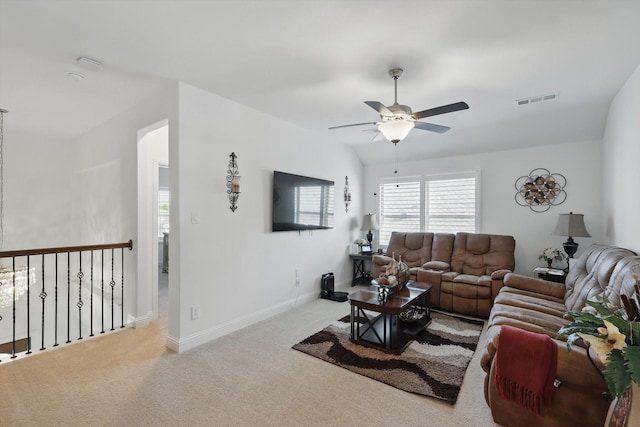 14329 Home Trl, Fort Worth, TX 76262 - carpeted living area featuring baseboards, visible vents, and a ceiling fan