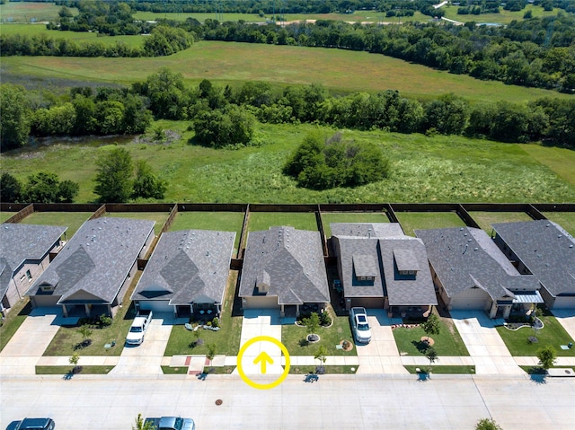 birds eye view of property with a residential view
