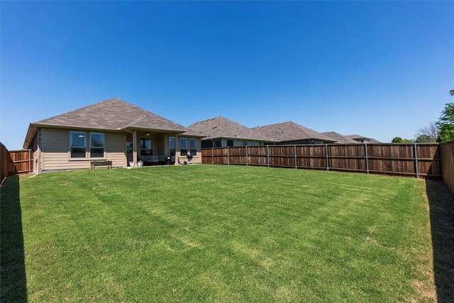 view of yard featuring a fenced backyard