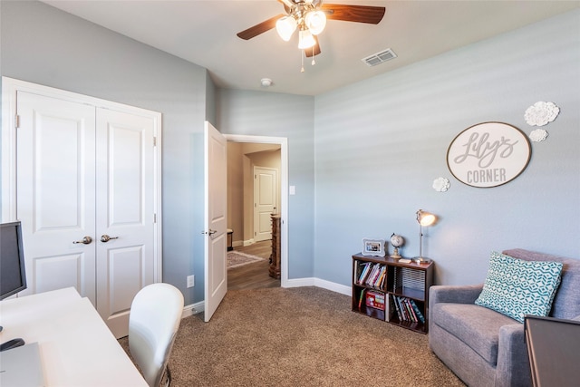 carpeted office with visible vents, a ceiling fan, and baseboards