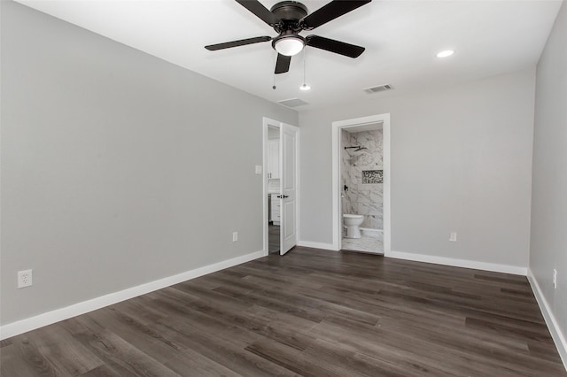 4227 Harvey Dr, Mesquite, TX 75150 - unfurnished bedroom featuring dark wood finished floors, baseboards, connected bathroom, and a ceiling fan