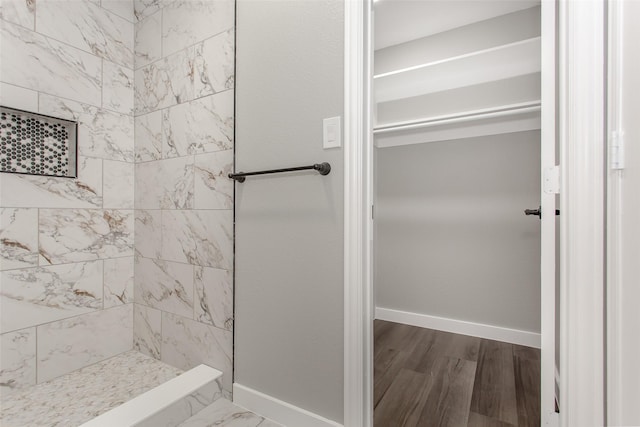 4227 Harvey Dr, Mesquite, TX 75150 - full bathroom featuring tiled shower, baseboards, and wood finished floors