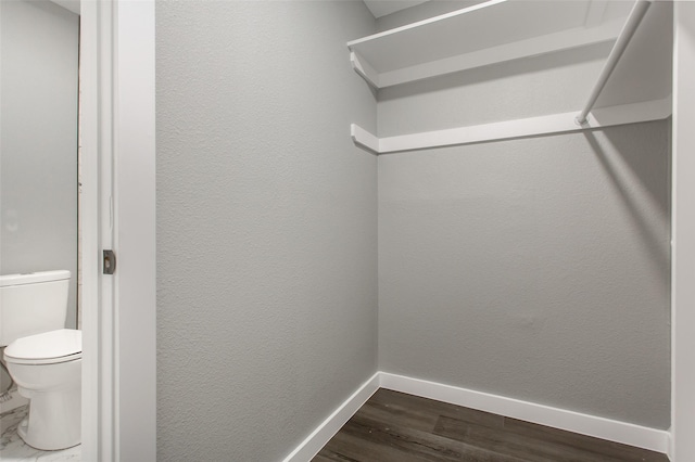 4227 Harvey Dr, Mesquite, TX 75150 - spacious closet featuring dark wood finished floors
