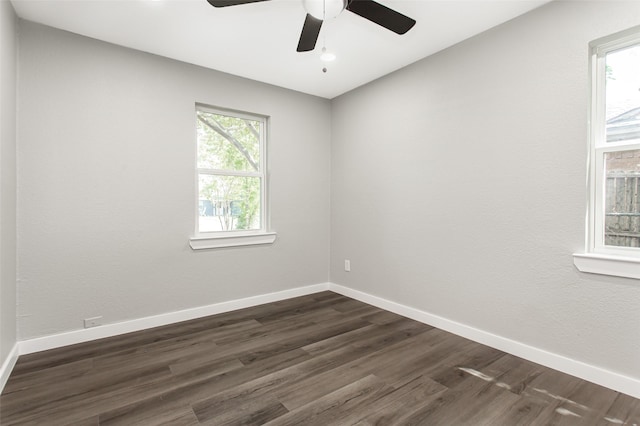 4227 Harvey Dr, Mesquite, TX 75150 - empty room with a ceiling fan, dark wood-style floors, and baseboards