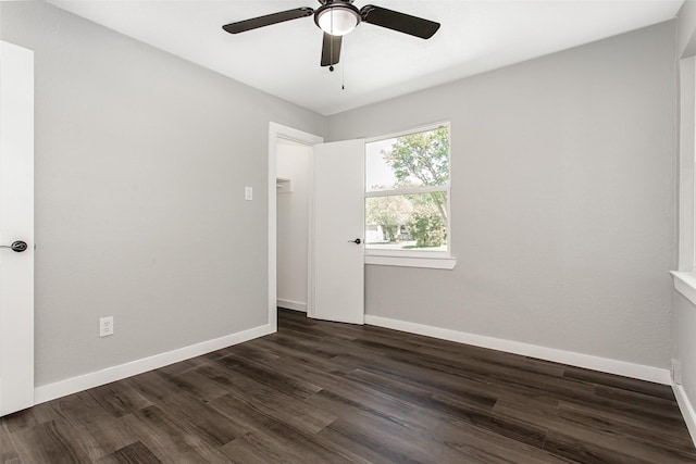 4227 Harvey Dr, Mesquite, TX 75150 - empty room featuring dark wood-style flooring, ceiling fan, and baseboards