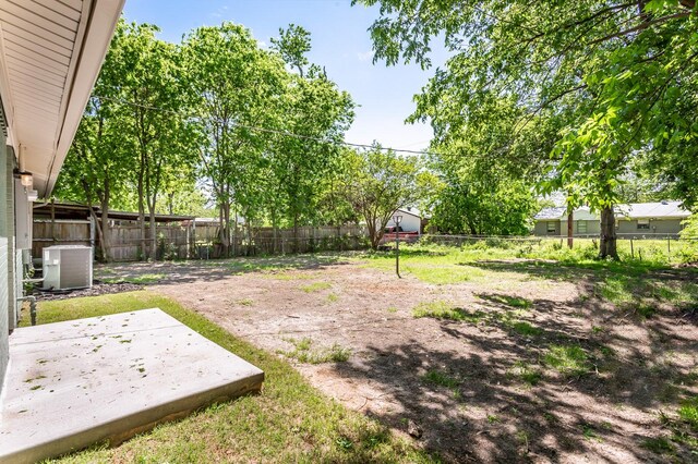 4227 Harvey Dr, Mesquite, TX 75150 - fenced backyard featuring a patio area and cooling unit