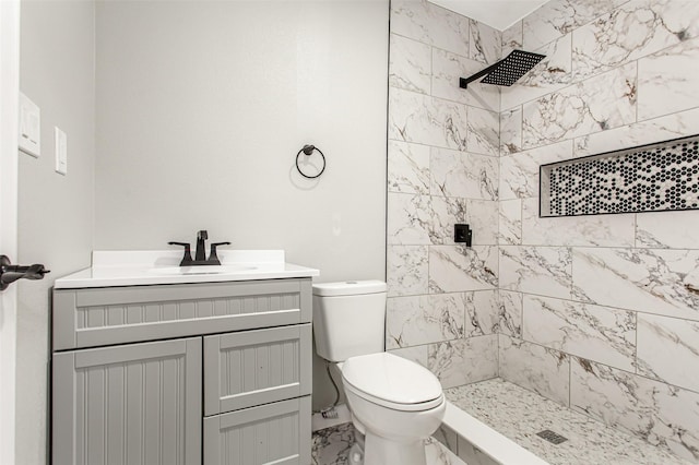 4227 Harvey Dr, Mesquite, TX 75150 - bathroom with marble look tiles, a tile shower, toilet, and vanity