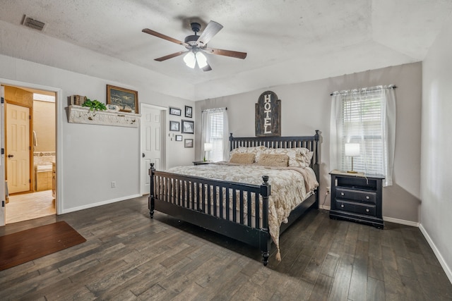 bedroom featuring visible vents, hardwood / wood-style flooring, baseboards, and ceiling fan
