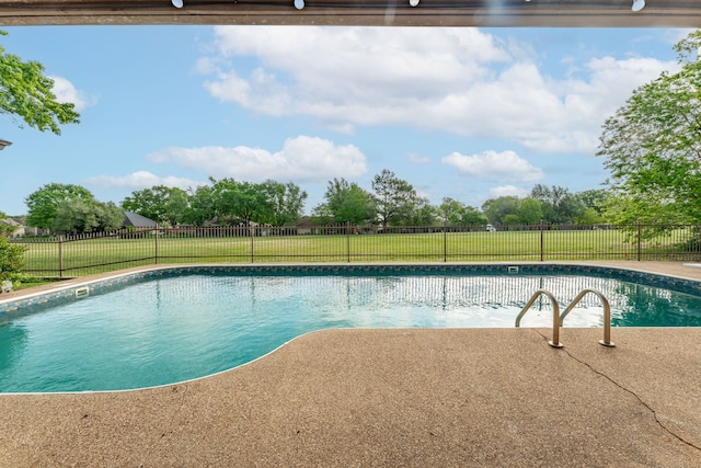 view of swimming pool featuring a fenced backyard, a fenced in pool, and a yard