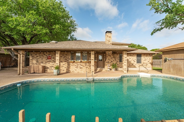 view of swimming pool with fence, a patio, and a fenced in pool