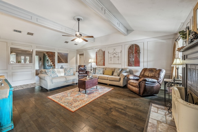 living area with visible vents, a ceiling fan, wood-type flooring, a decorative wall, and lofted ceiling with beams
