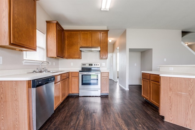 504 Ame Ln, Royse City, TX 75189 - kitchen featuring appliances with stainless steel finishes, under cabinet range hood, a sink, dark wood-style floors, and light countertops