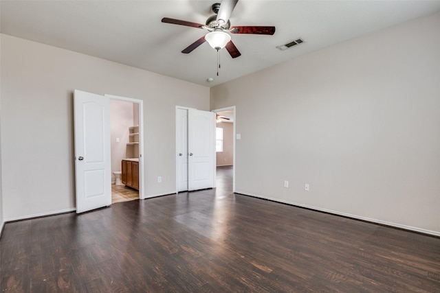 504 Ame Ln, Royse City, TX 75189 - unfurnished bedroom featuring wood finished floors, ensuite bathroom, baseboards, and a ceiling fan