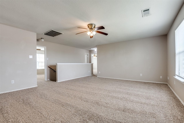 504 Ame Ln, Royse City, TX 75189 - empty room with a ceiling fan, light colored carpet, and baseboards