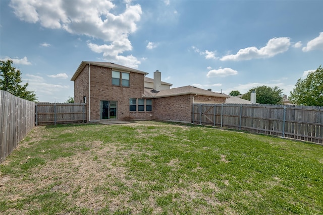 504 Ame Ln, Royse City, TX 75189 - back of property featuring brick siding and a chimney