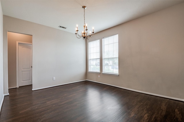 504 Ame Ln, Royse City, TX 75189 - empty room featuring a chandelier, dark wood-type flooring, and baseboards