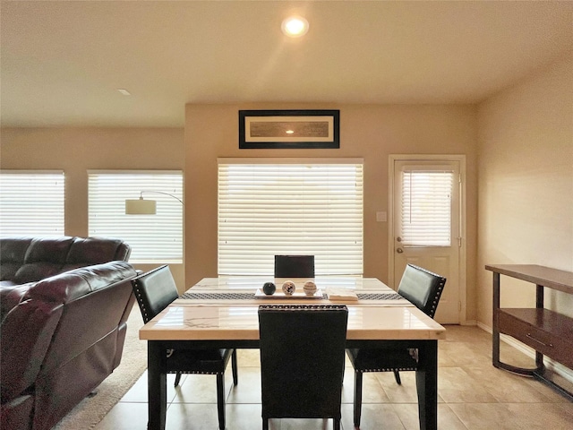 dining room featuring recessed lighting and light tile patterned floors