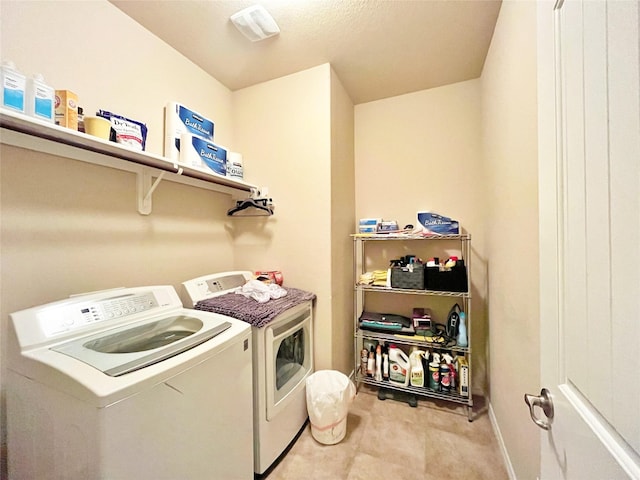 laundry room with washing machine and clothes dryer and laundry area
