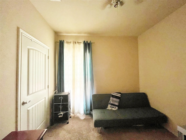 living area featuring carpet