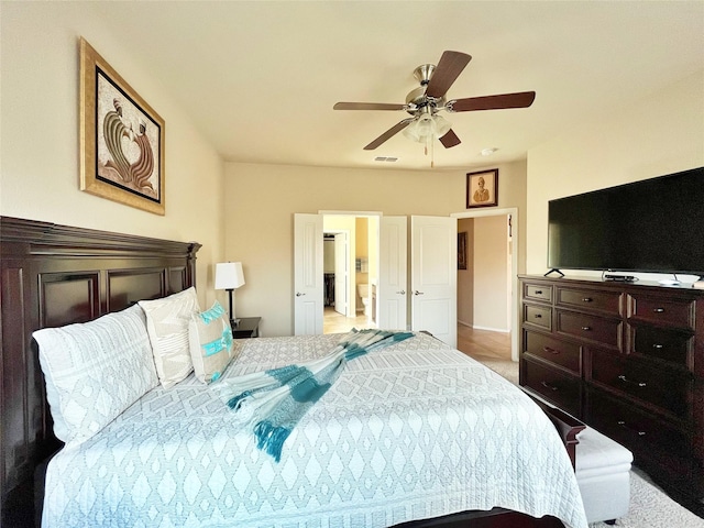 bedroom featuring ceiling fan, light carpet, and visible vents