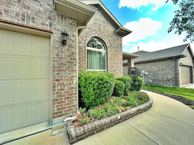 view of exterior entry with a garage