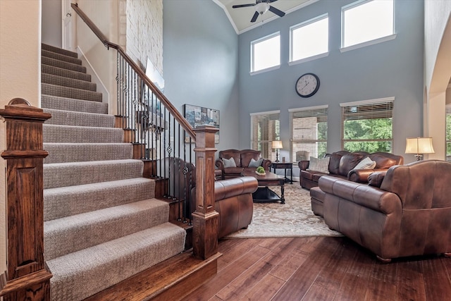 2833 Macquarie St, Trophy Club, TX 76262 - living area with ceiling fan, high vaulted ceiling, hardwood / wood-style floors, ornamental molding, and stairway