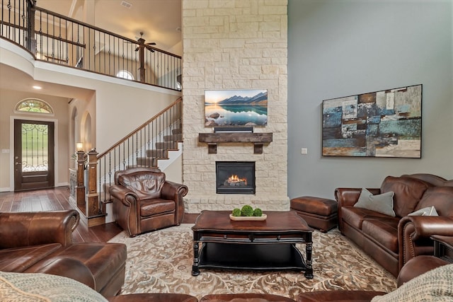 2833 Macquarie St, Trophy Club, TX 76262 - living room with a high ceiling, stairs, wood finished floors, and a fireplace