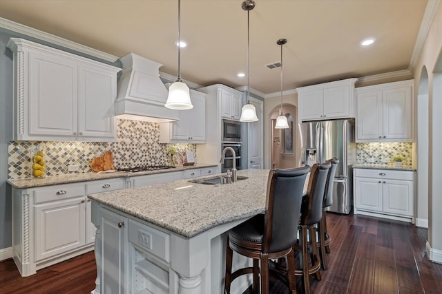 2833 Macquarie St, Trophy Club, TX 76262 - kitchen featuring decorative backsplash, visible vents, a sink, custom exhaust hood, and stainless steel appliances