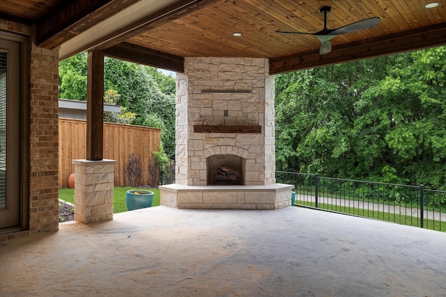 2833 Macquarie St, Trophy Club, TX 76262 - view of patio featuring an outdoor stone fireplace, ceiling fan, and fence