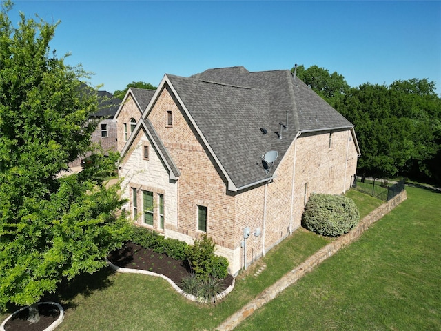 2833 Macquarie St, Trophy Club, TX 76262 - view of home's exterior featuring a yard, brick siding, a shingled roof, and stone siding