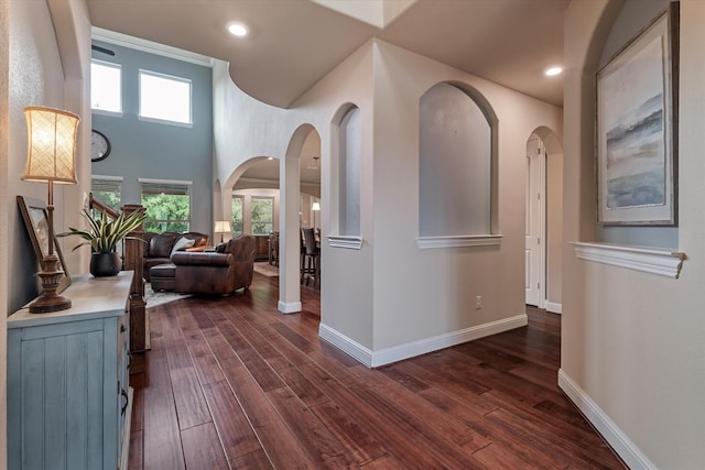 2833 Macquarie St, Trophy Club, TX 76262 - hallway featuring dark wood-style flooring, arched walkways, and baseboards