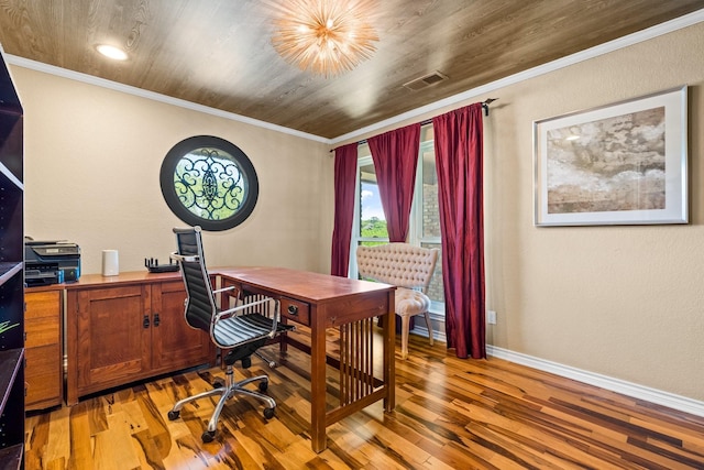 office featuring baseboards, visible vents, ornamental molding, and light wood-style flooring