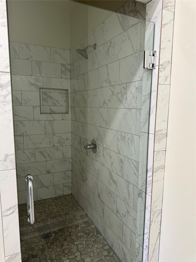full bath featuring a shower stall