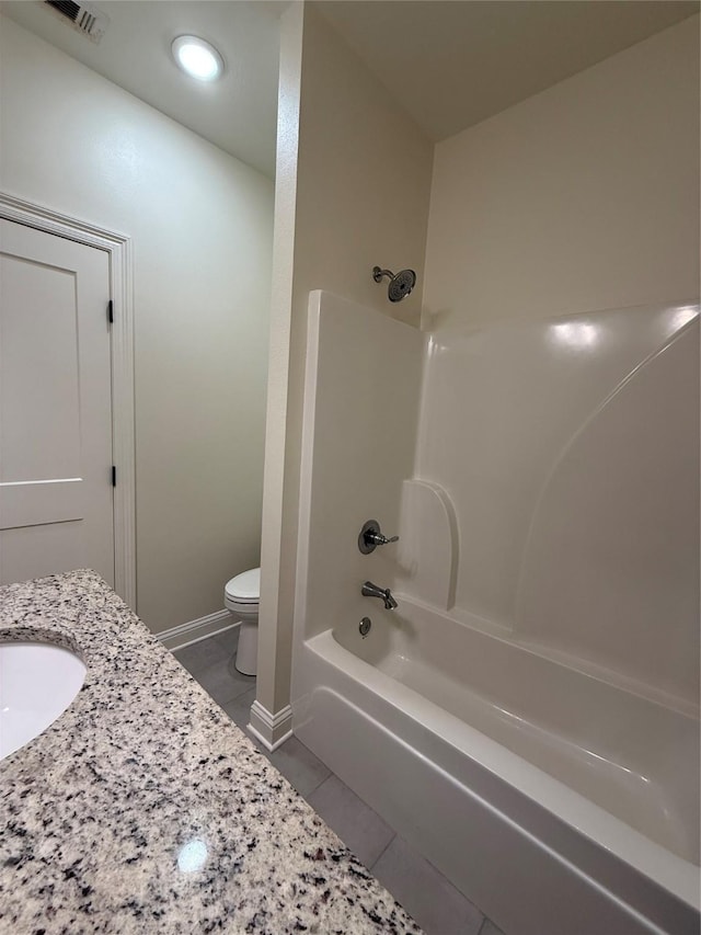 bathroom featuring tile patterned floors, visible vents, shower / bath combination, toilet, and baseboards