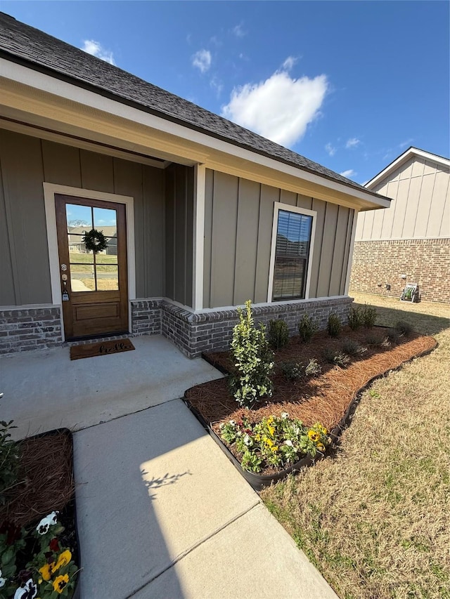 doorway to property with board and batten siding