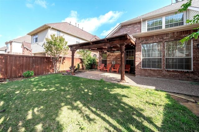 view of yard with a fenced backyard, a patio, and ceiling fan