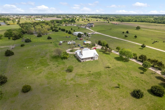 birds eye view of property featuring a rural view