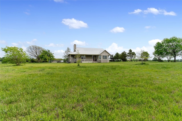 view of yard with covered porch