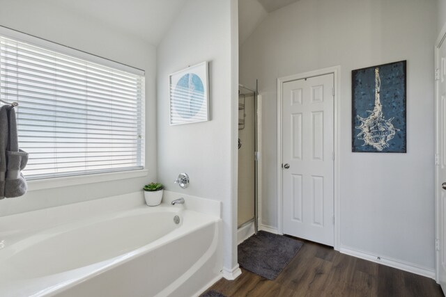 2820 Lone Ranger Trl, Little Elm, TX 75068 - bathroom with a garden tub, a stall shower, lofted ceiling, wood finished floors, and baseboards