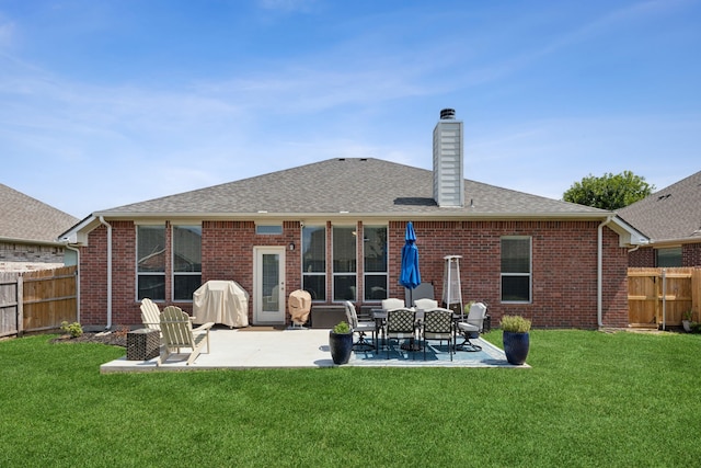 2820 Lone Ranger Trl, Little Elm, TX 75068 - rear view of property with a chimney, brick siding, a patio, and a shingled roof